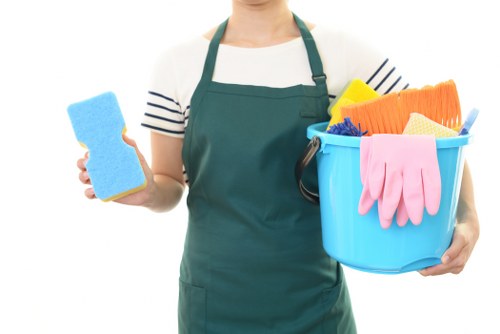 Technician preparing carpet cleaning equipment in a safe indoor setting