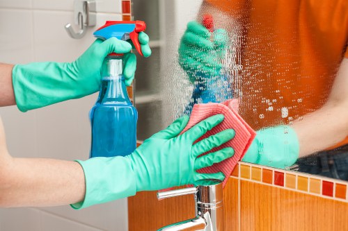 Carpet cleaning staff using safe equipment in a protected workspace
