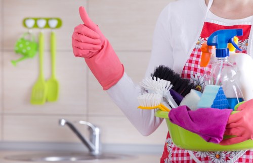 Cleaner treating stains during commercial carpet cleaning in Brent Cross