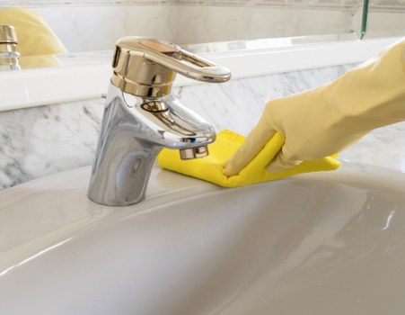 Technician removing stains during mattress cleaning in Brent Cross